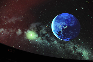 （写真）プラネタリウムに映し出された地球と銀河の星